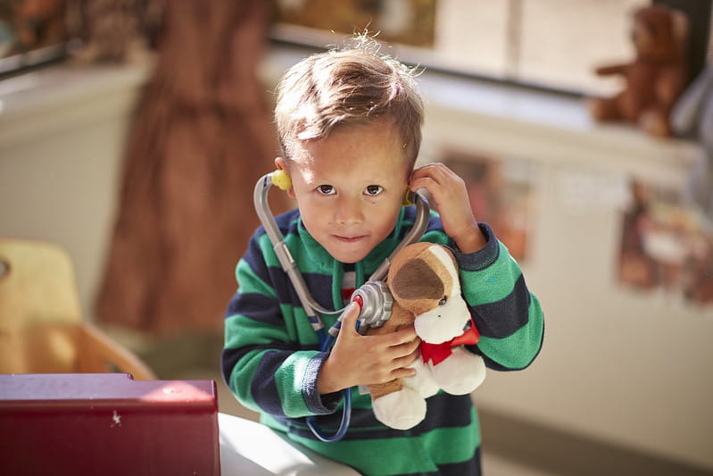 Child playing as a pretend Veterinarian 